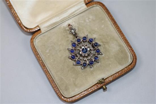 A late Victorian yellow metal, cabochon sapphire and diamond set pendant brooch, brooch diameter 25mm.